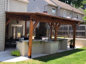 Outdoor Kitchen with Fireplace and Pergola